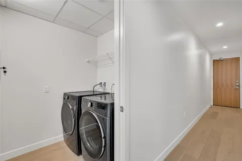 a bathroom with a double vanity sink a and a shower