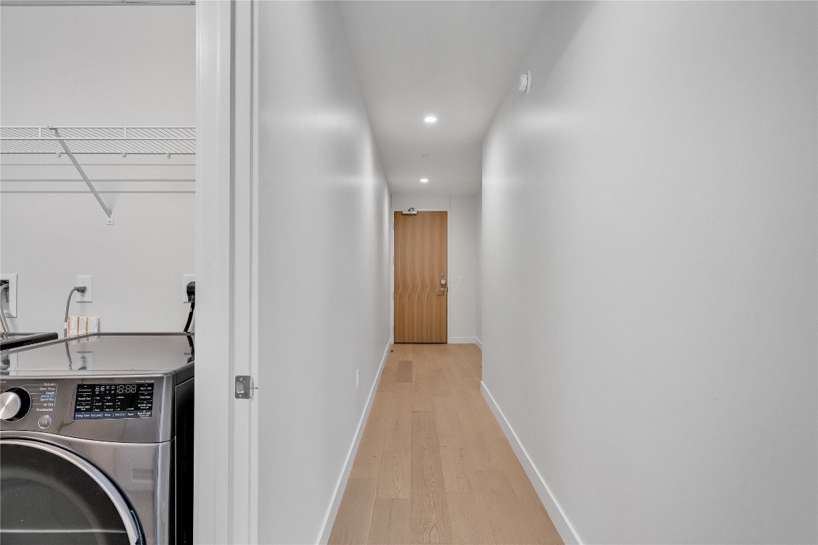 44 East Avenue, Unit 3107 Austin, TX 78701 - Photo 22 of 40 a view of a hallway with washer and dryer
