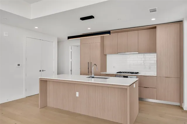 an empty room with wooden floor and walls