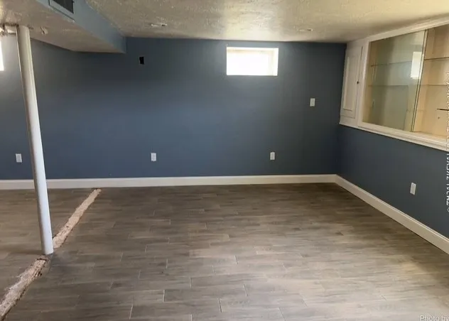 wooden floor and window in an empty room