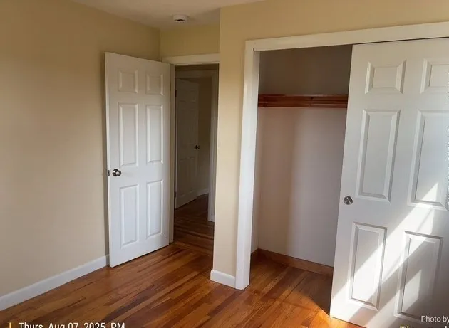 a view of entryway with wooden floor