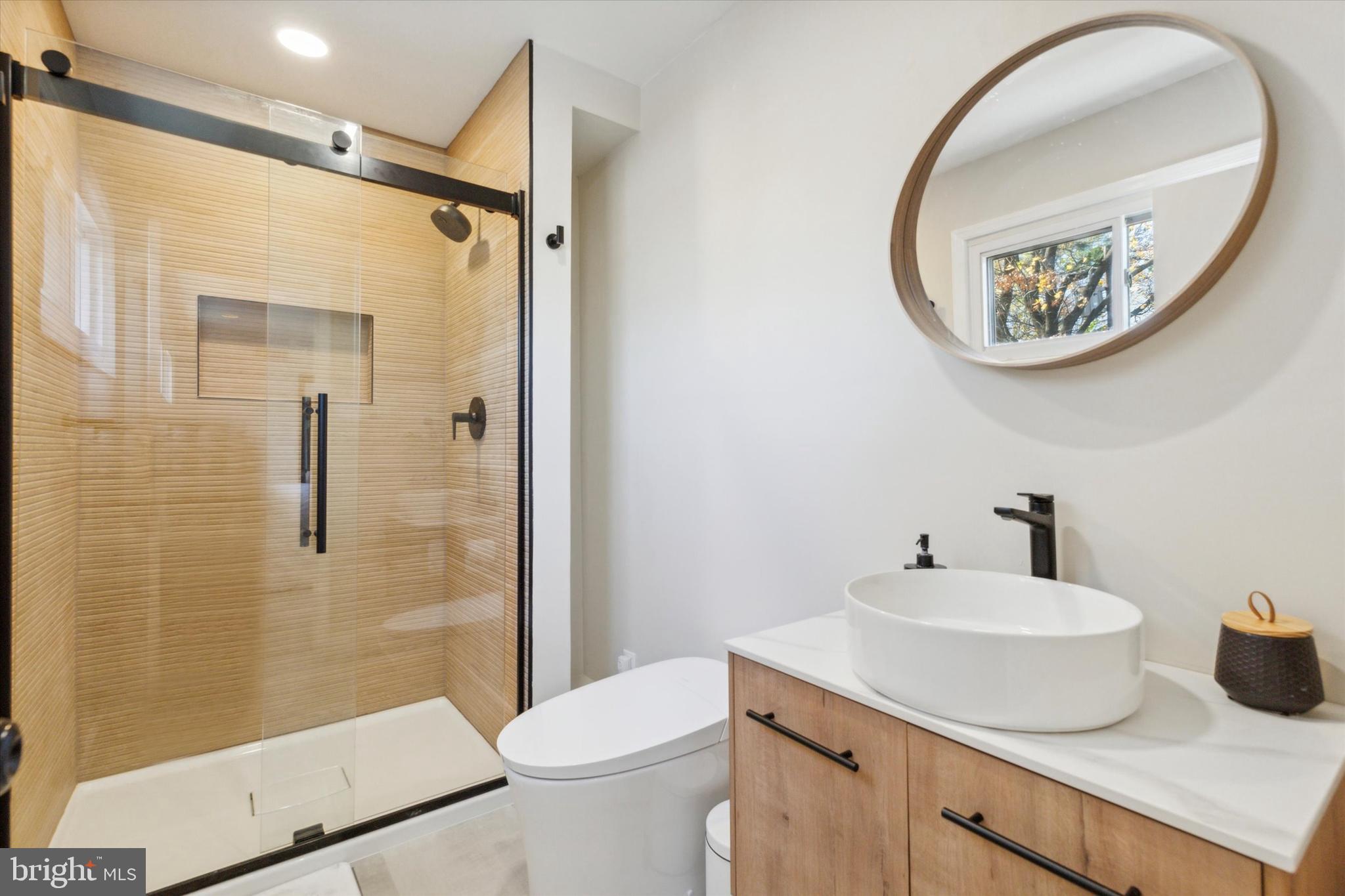 135 Cornell Road Bala Cynwyd, PA 19004 - Photo 11 of 23 a bathroom with a sink a mirror a toilet and a shower