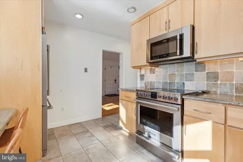 a kitchen with a stove microwave and refrigerator