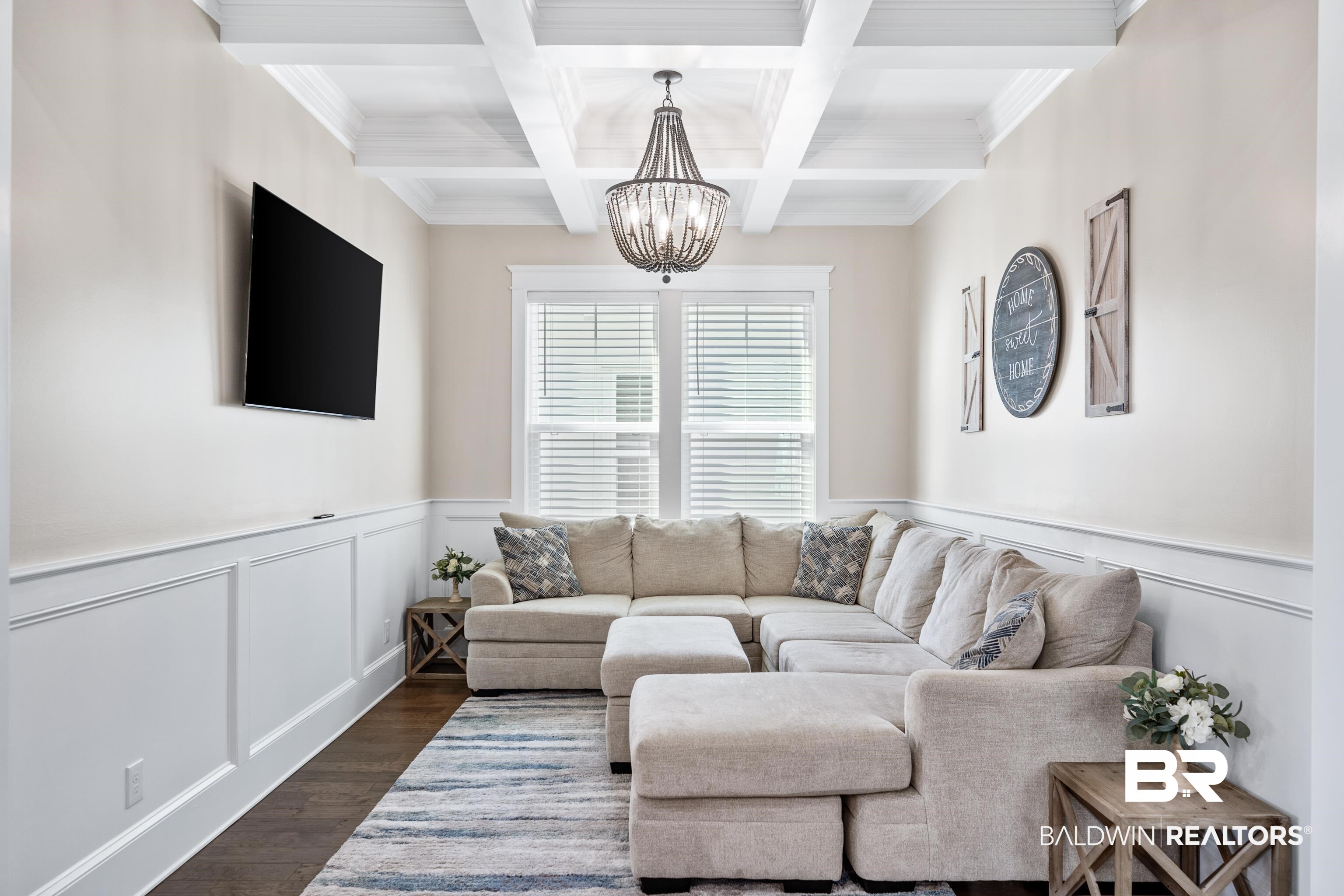 1018 Snapdragon Lane Foley, AL 36535 - Photo 18 of 37 Living room with beam ceiling, coffered ceiling, and a notable chandelier