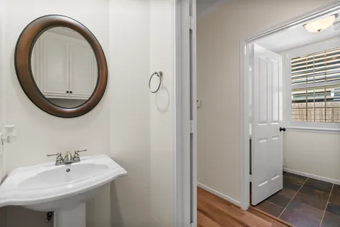 a view of a patio with table and chairs and potted plants