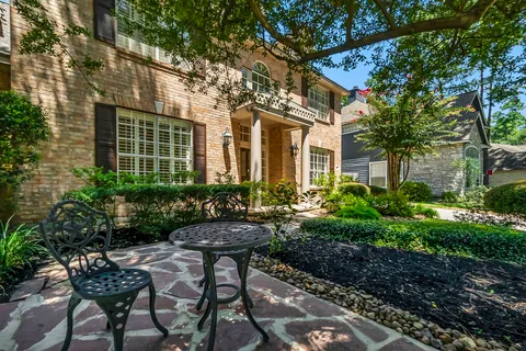 a view of a room with wooden floor and windows