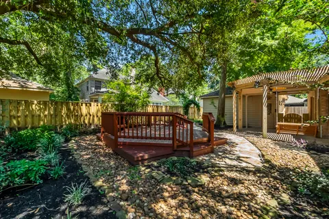 a view of a backyard with large trees