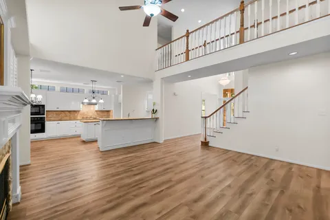 a view of kitchen with furniture and wooden floor