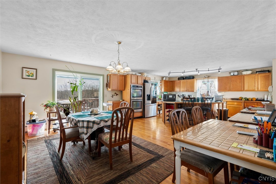 2336 Turner Road Cato, NY 13166 - Photo 7 of 44 Eat-in kitchen with sliders to deck (deck boars re
