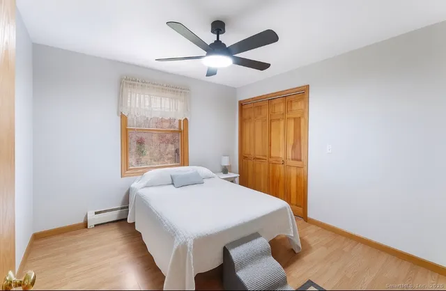 a workspace with wooden floor and windows