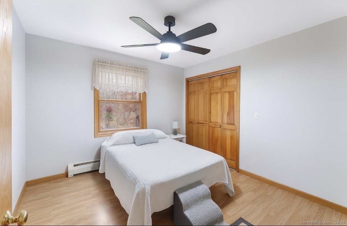 63 Buck Hill Road Canterbury, CT 06331 - Photo 11 of 25 a workspace with wooden floor and windows