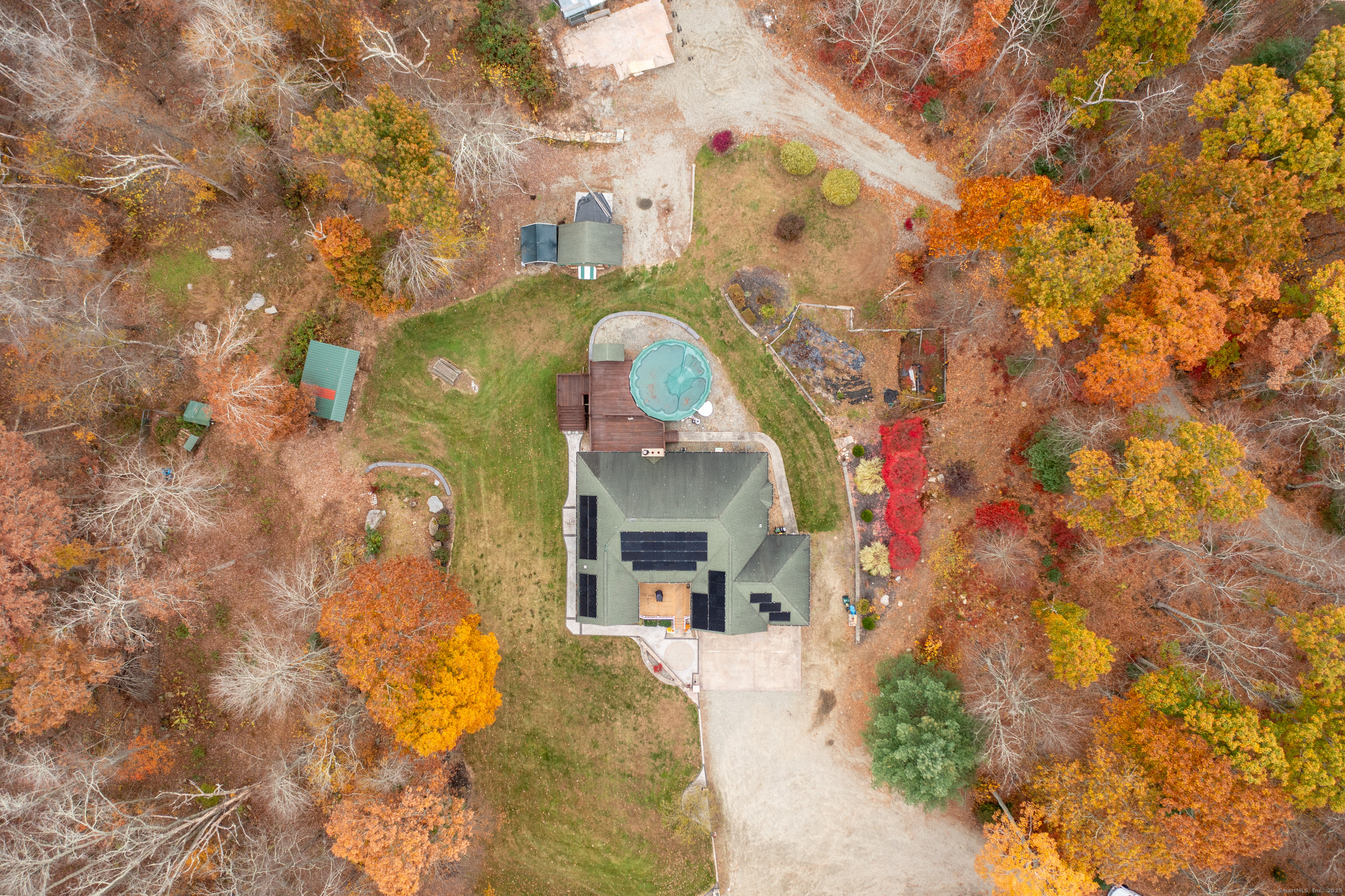 63 Buck Hill Road Canterbury, CT 06331 - Photo 23 of 25 a view of a multi story residential apartment building with a yard