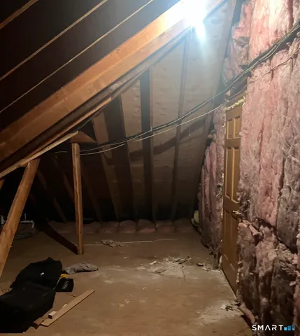 a front view of a house with a garden and yard