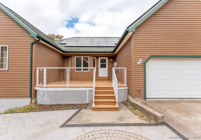 a front view of a house with a garage