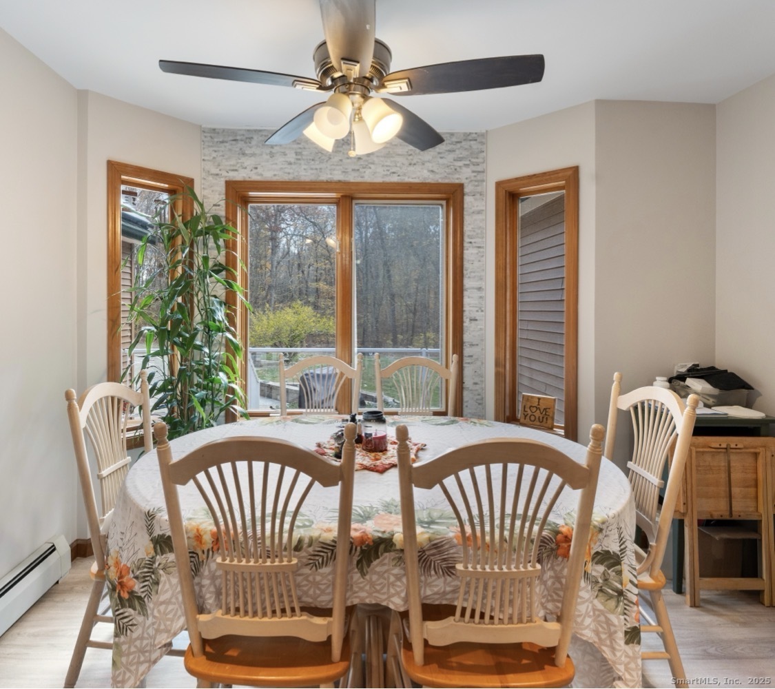 63 Buck Hill Road Canterbury, CT 06331 - Photo 7 of 25 a view of a dining room with furniture window and outside view