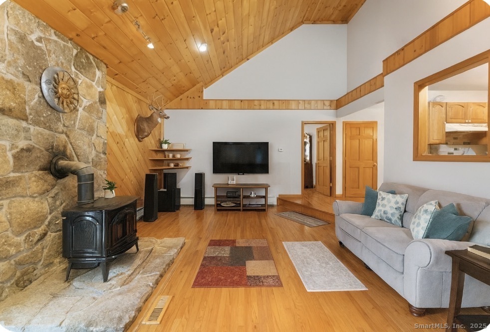 63 Buck Hill Road Canterbury, CT 06331 - Photo 9 of 25 a living room with furniture and a flat screen tv