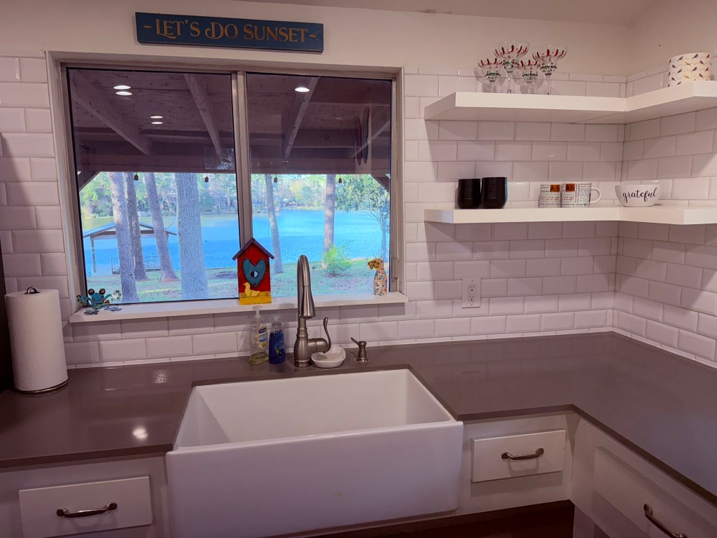 251 County Road Goodrich, TX 77335 - Photo 14 of 50 a bathroom with a sink a bathtub and window