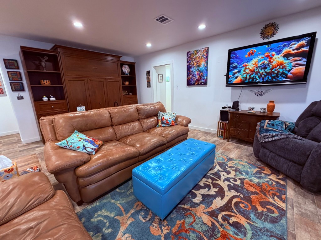 251 County Road Goodrich, TX 77335 - Photo 17 of 50 a living room with furniture and a flat screen tv