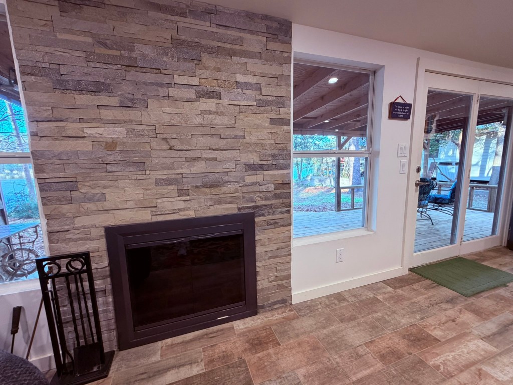 251 County Road Goodrich, TX 77335 - Photo 18 of 50 a living room with a fireplace