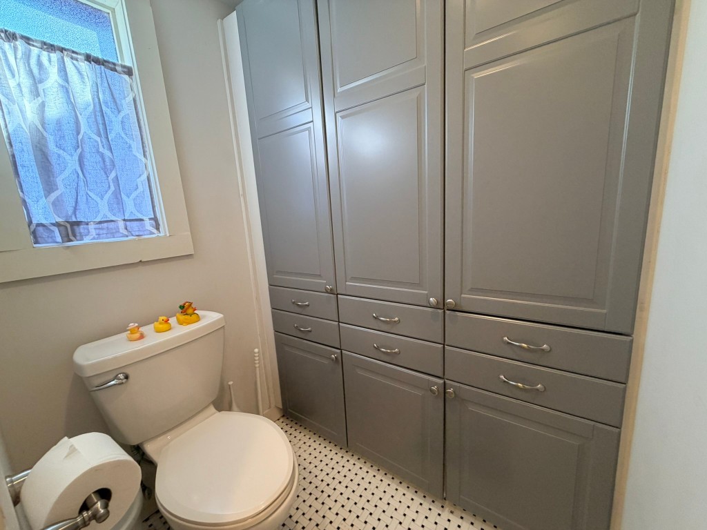 251 County Road Goodrich, TX 77335 - Photo 24 of 50 a bathroom with a toilet and a shower curtain