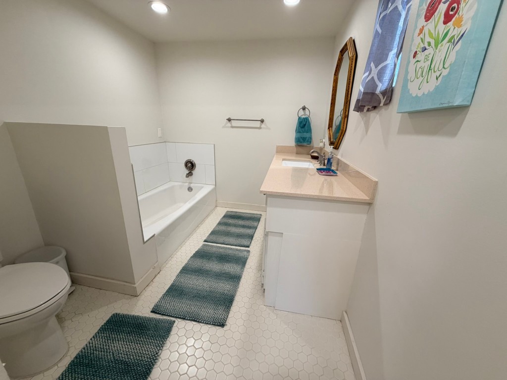 251 County Road Goodrich, TX 77335 - Photo 26 of 50 a bathroom with a sink a toilet and a mirror