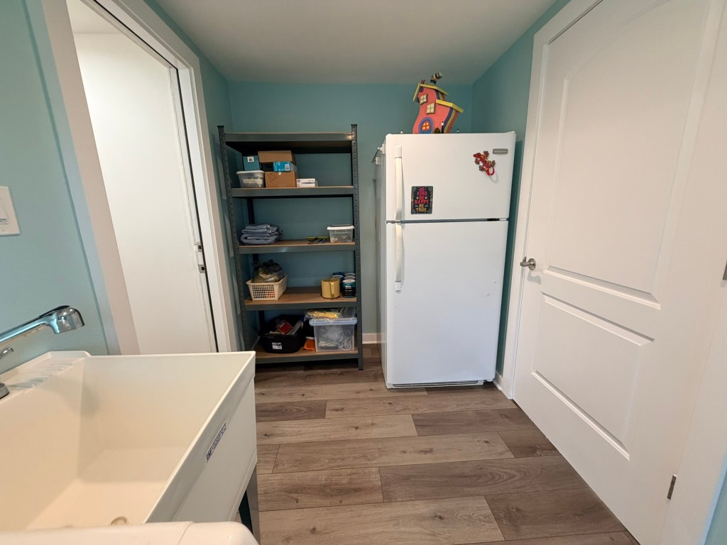 251 County Road Goodrich, TX 77335 - Photo 29 of 50 a white refrigerator freezer sitting inside of a kitchen