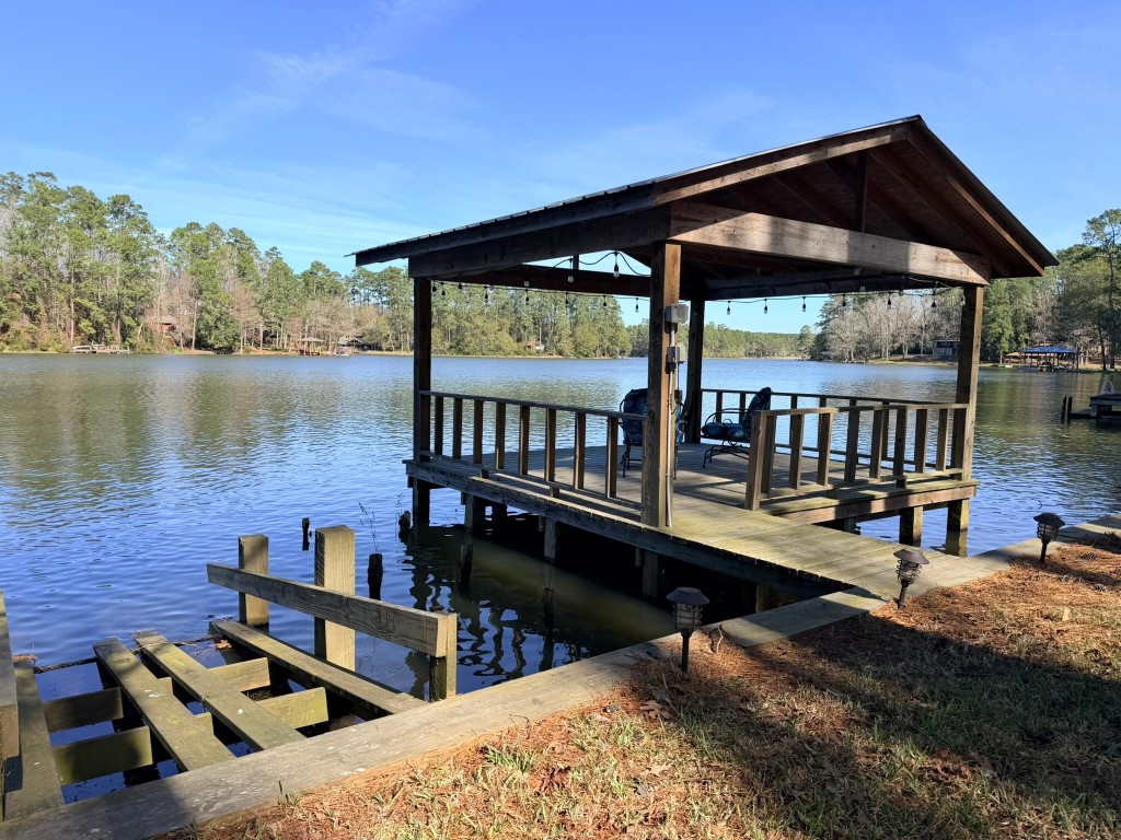 251 County Road Goodrich, TX 77335 - Photo 33 of 50 a view of a roof deck with chair and wooden floor