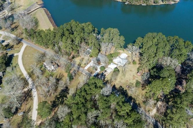 251 County Road Goodrich, TX 77335 - Photo 50 of 50 an aerial view of a house with a yard