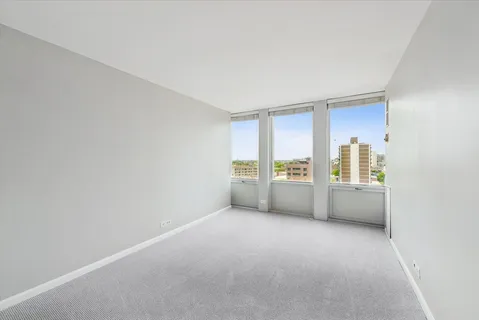 a view of an empty room with a window