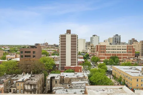 a view of a city with tall buildings