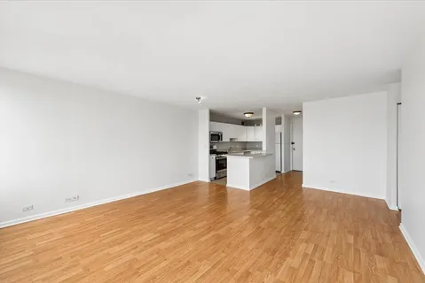 a view of kitchen with wooden floor