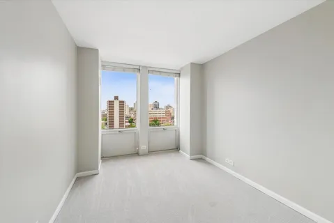 a view of an empty room with a window
