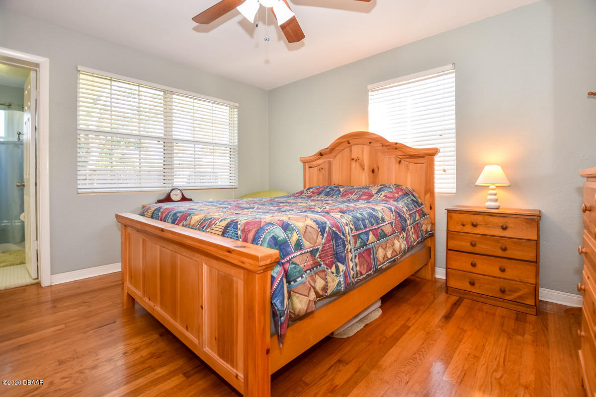 1509 Ridge Avenue Holly Hill, FL 32117 - Photo 18 of 40 a bedroom with a bed and a window