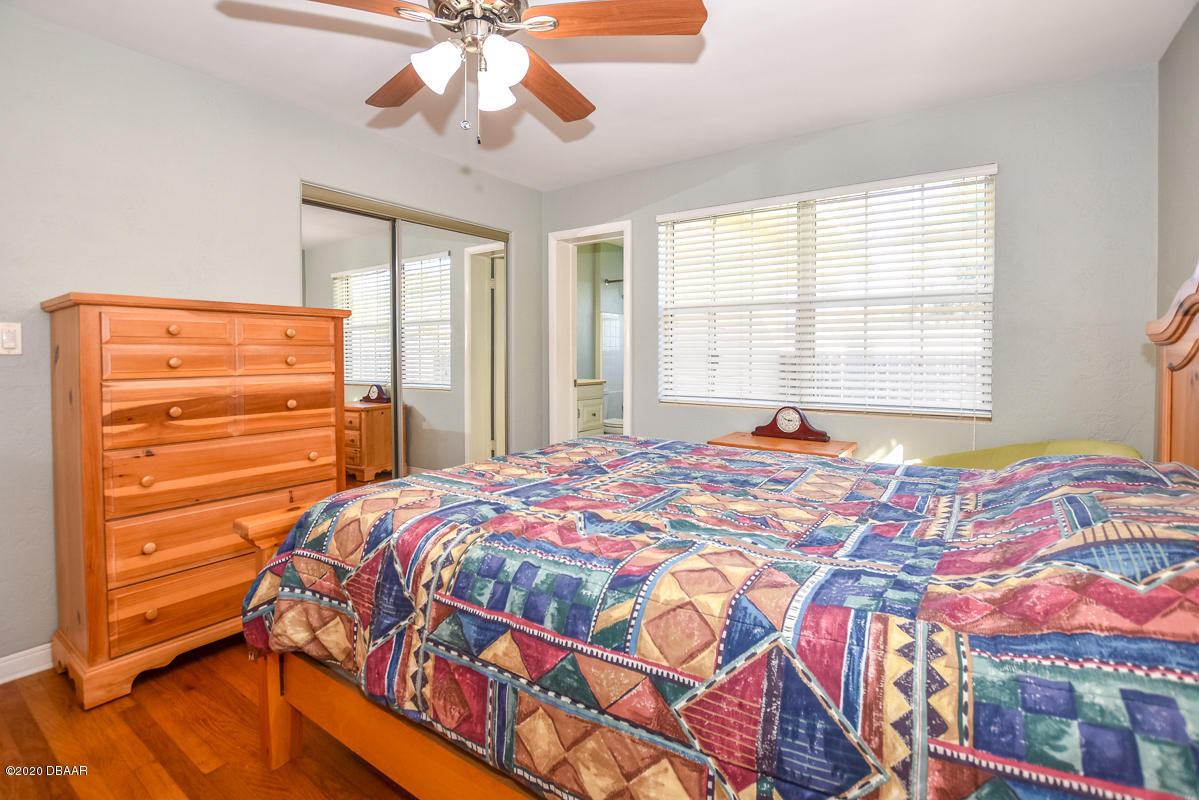 1509 Ridge Avenue Holly Hill, FL 32117 - Photo 19 of 40 a bedroom with a bed and a window