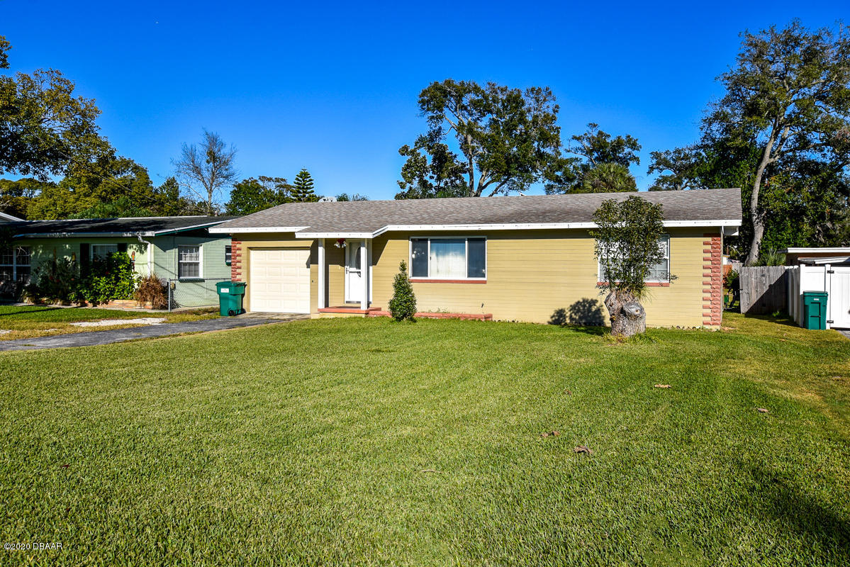 1509 Ridge Avenue Holly Hill, FL 32117 - Photo 2 of 40 a front view of a house with garden
