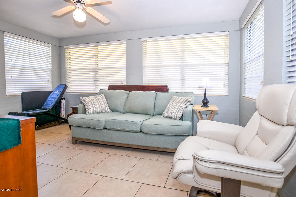 1509 Ridge Avenue Holly Hill, FL 32117 - Photo 29 of 40 a living room with furniture and a large window