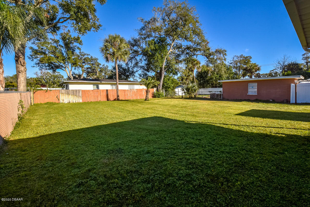 1509 Ridge Avenue Holly Hill, FL 32117 - Photo 31 of 40 a view of a house with a big yard