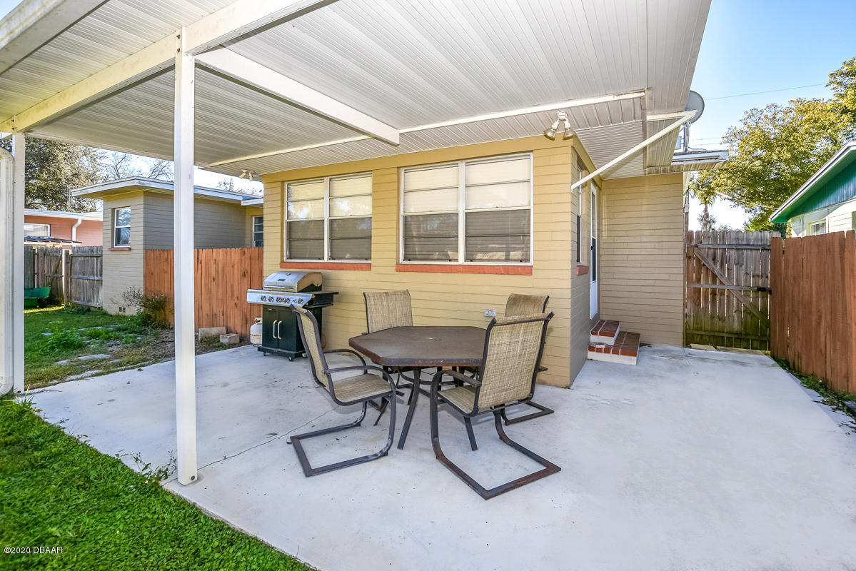1509 Ridge Avenue Holly Hill, FL 32117 - Photo 33 of 40 a view of a house with backyard and sitting area