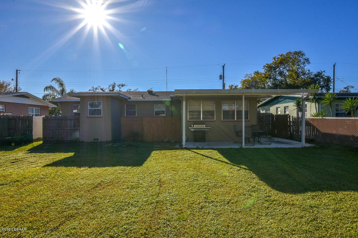 1509 Ridge Avenue Holly Hill, FL 32117 - Photo 35 of 40 a view of a backyard with plants and patio