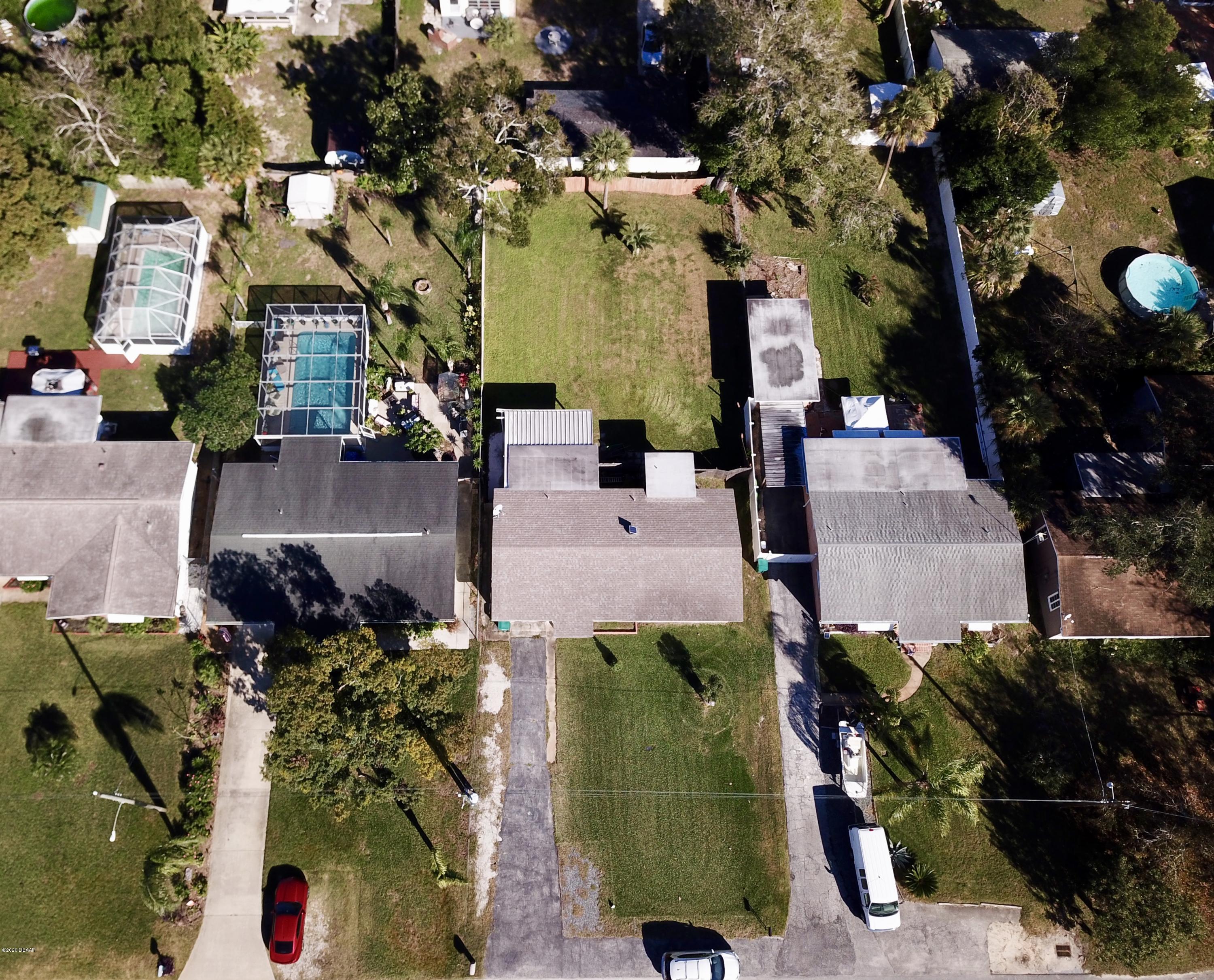 1509 Ridge Avenue Holly Hill, FL 32117 - Photo 37 of 40 an aerial view of multiple houses with outdoor space