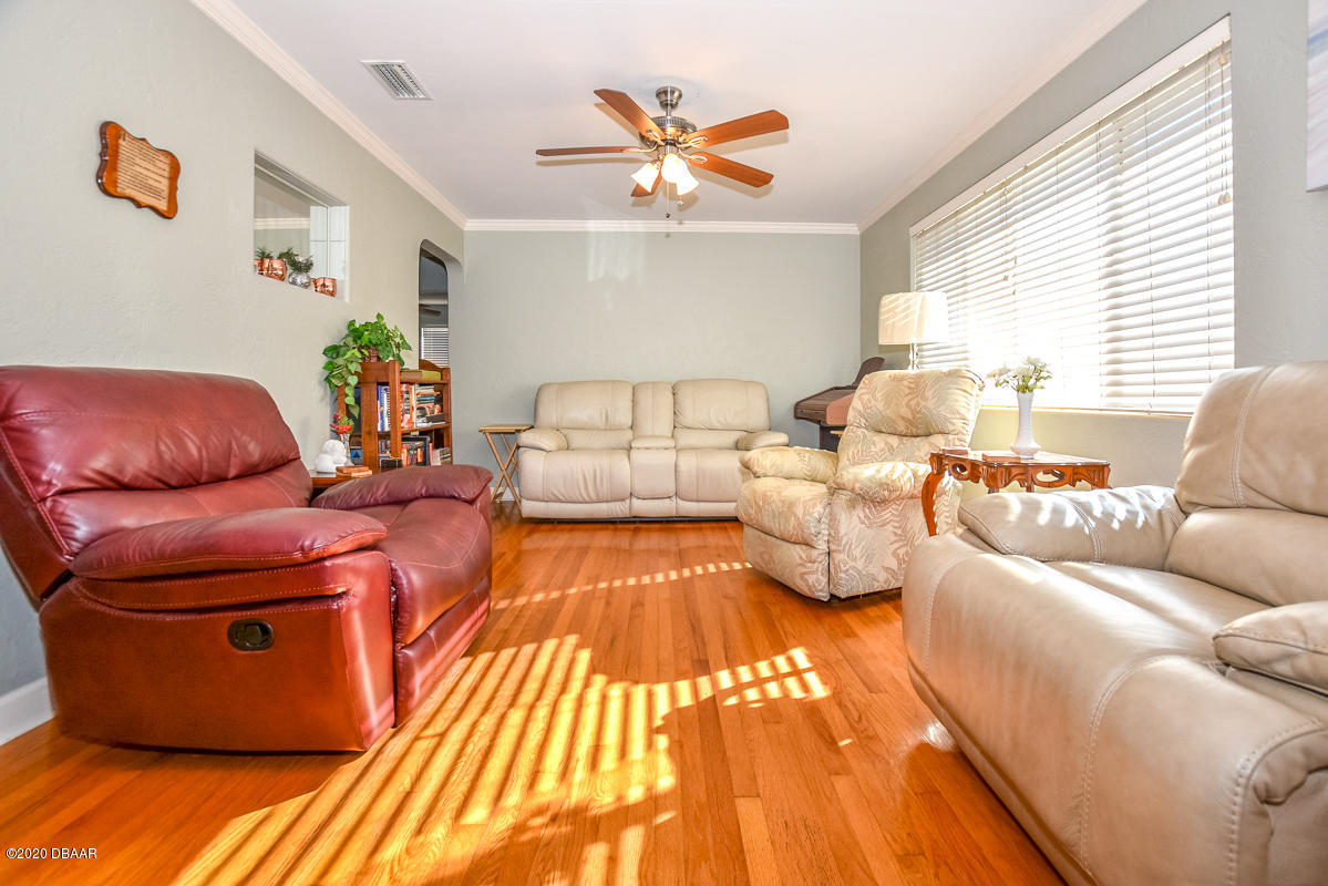 1509 Ridge Avenue Holly Hill, FL 32117 - Photo 7 of 40 a living room with furniture and a large window