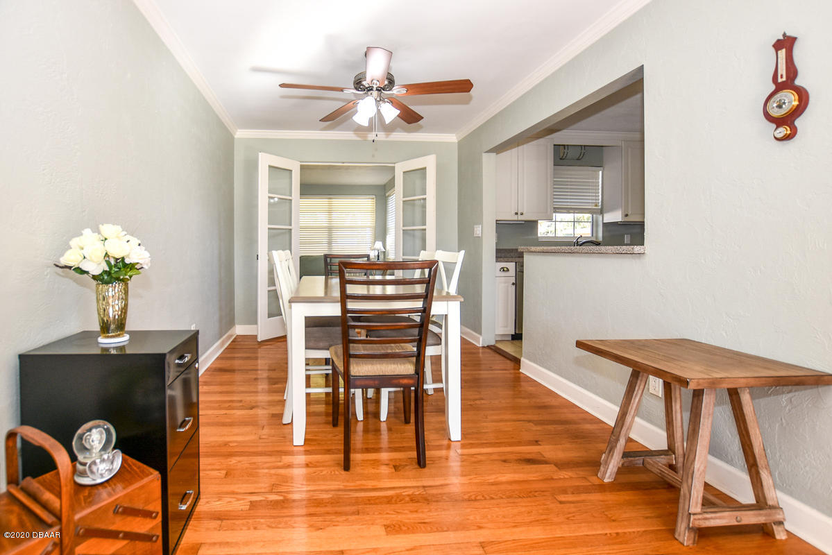 1509 Ridge Avenue Holly Hill, FL 32117 - Photo 8 of 40 a view of a dining room with furniture and wooden floor