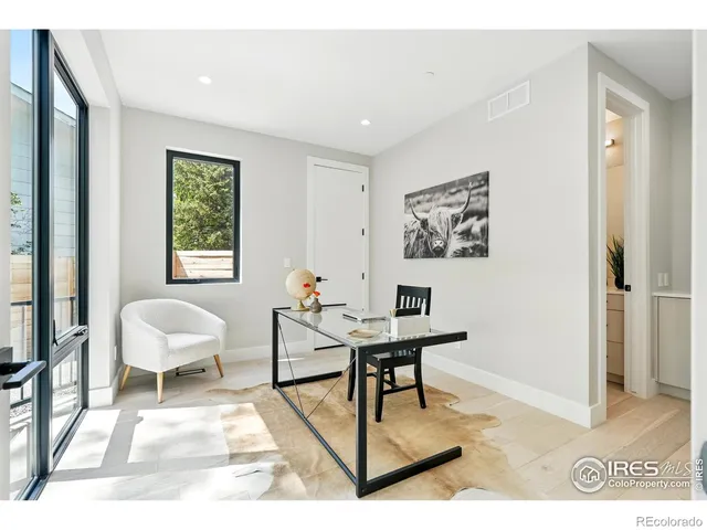 a workspace with furniture and window