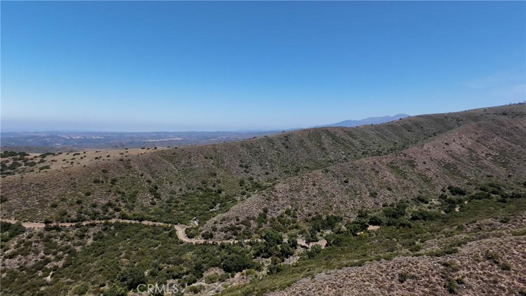 0 Vacant Land Lake Fallbrook, CA 92028 - Photo 13 of 29 a view of a dry yard with mountains in the background