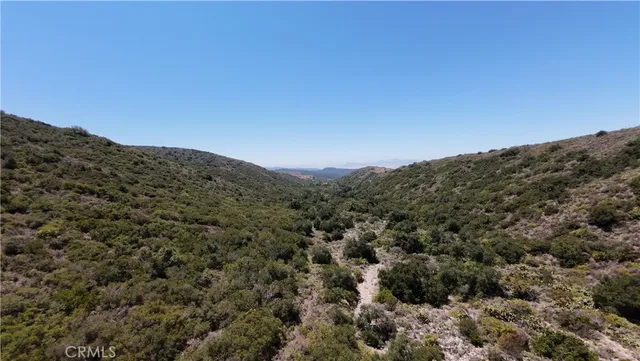 a view of a house with a mountain in the background