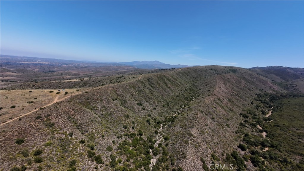 0 Vacant Land Lake Fallbrook, CA 92028 - Photo 3 of 29 a view of a dry yard with mountains in the background