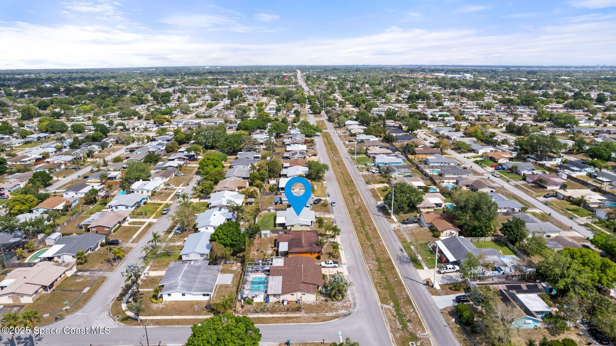 520 Croton Road Melbourne, FL 32935 - Photo 34 of 36 an aerial view of residential houses with city view