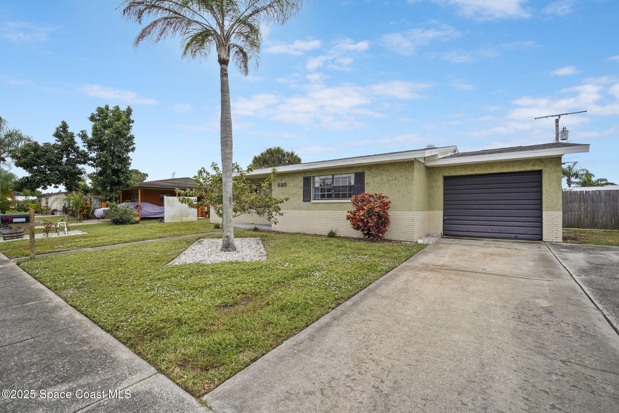 520 Croton Road Melbourne, FL 32935 - Photo 4 of 36 a front view of a house with garden