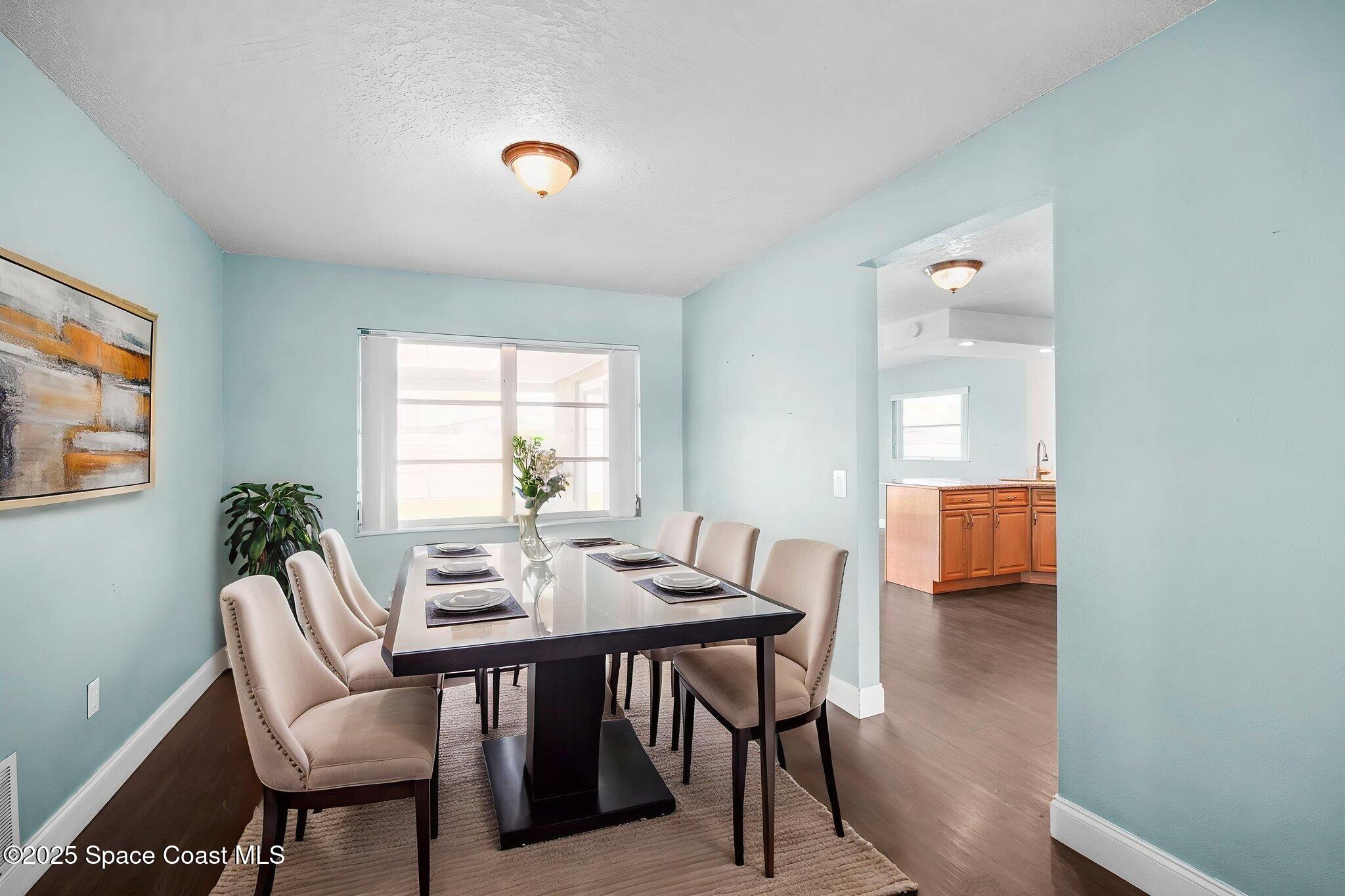 520 Croton Road Melbourne, FL 32935 - Photo 8 of 36 a view of a dining room with furniture window and outside view