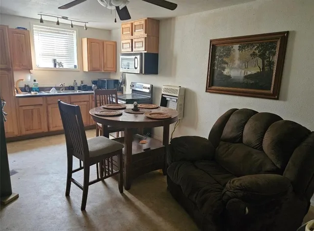 a dining room with furniture and window